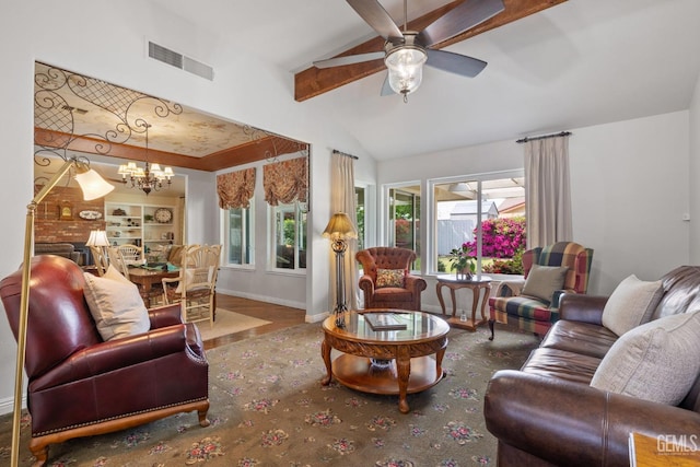 living room with ceiling fan with notable chandelier, baseboards, vaulted ceiling with beams, wood finished floors, and visible vents