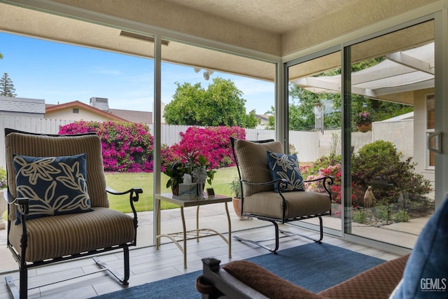 sunroom featuring a healthy amount of sunlight