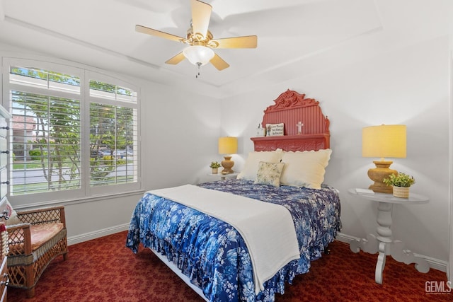 carpeted bedroom with baseboards and ceiling fan