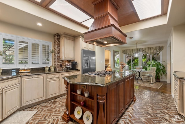 kitchen featuring recessed lighting, brick floor, island exhaust hood, and stainless steel appliances