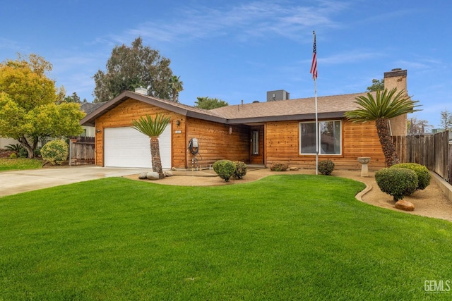 single story home with a garage, driveway, a front yard, and fence