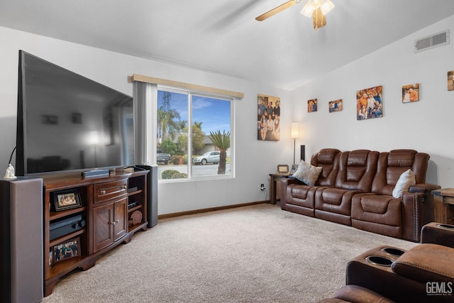 living room featuring ceiling fan, lofted ceiling, light carpet, visible vents, and baseboards