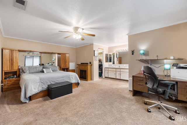 bedroom with ornamental molding, carpet, and visible vents