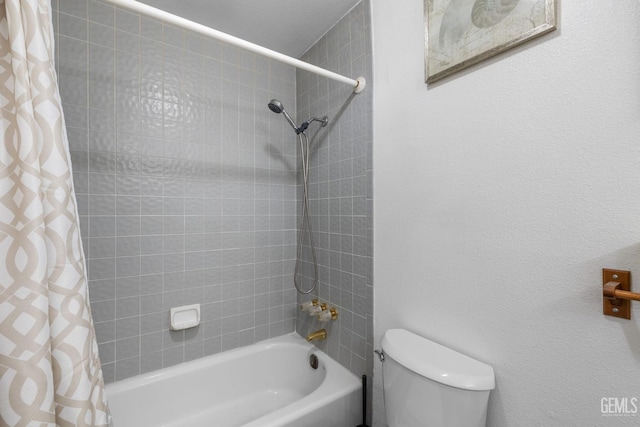 bathroom featuring toilet and shower / bath combo