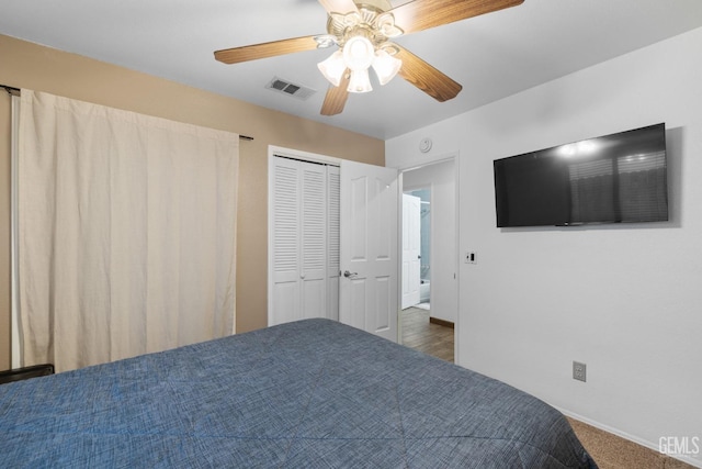 unfurnished bedroom with ceiling fan, visible vents, and a closet