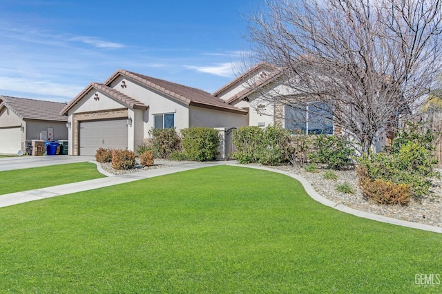 view of front of home featuring a garage and a front lawn