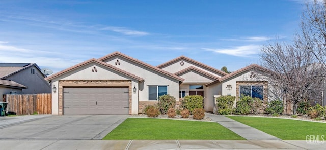 view of front facade with a garage and a front yard