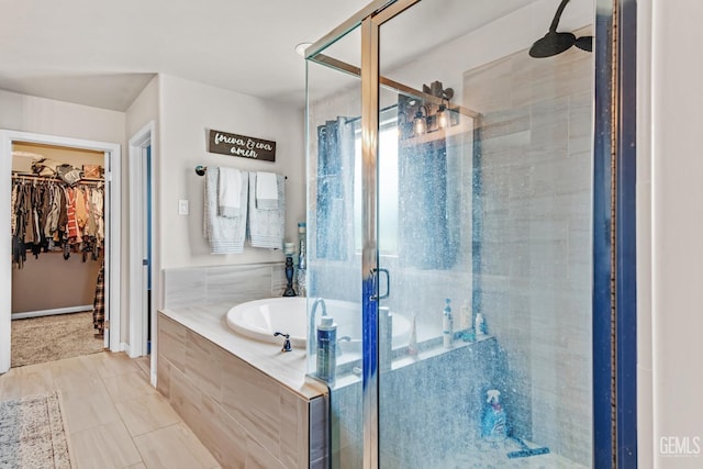 bathroom with tile patterned flooring and plus walk in shower