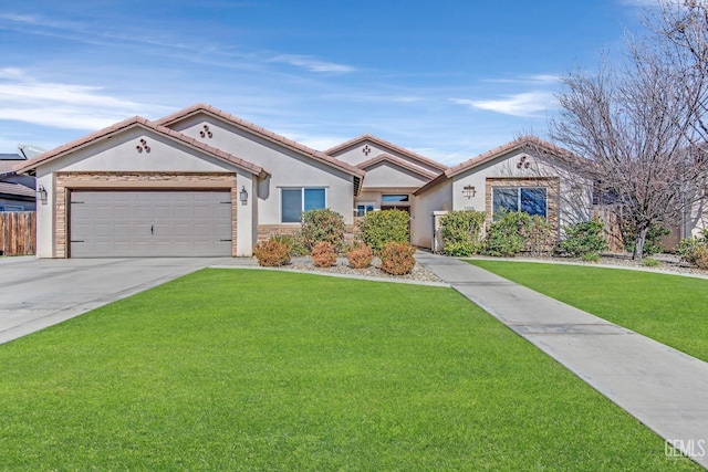 view of front of home featuring a garage and a front lawn