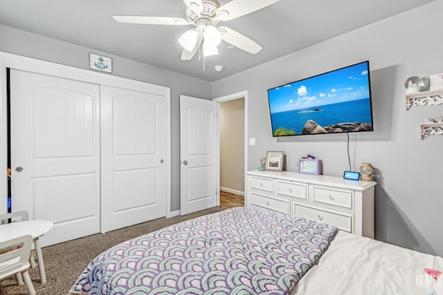 bedroom with carpet, ceiling fan, and a closet