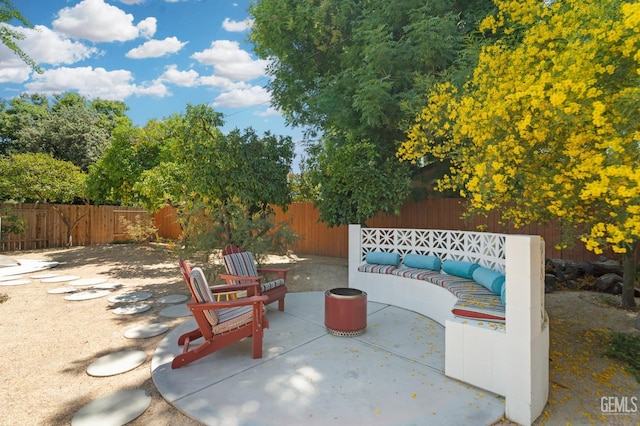2421 C St, Bakersfield, CA 93301 - fenced backyard with a patio area and an outdoor hangout area
