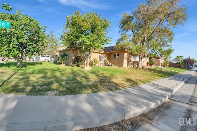 ranch-style home with a front yard