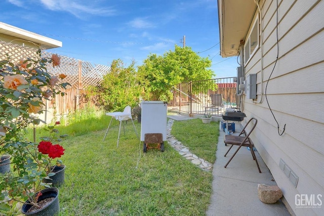 view of yard with a fenced backyard