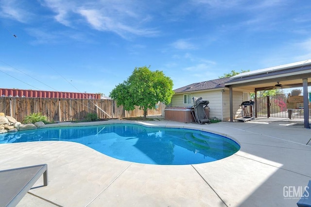 view of pool featuring a fenced backyard, a hot tub, a patio area, and a fenced in pool