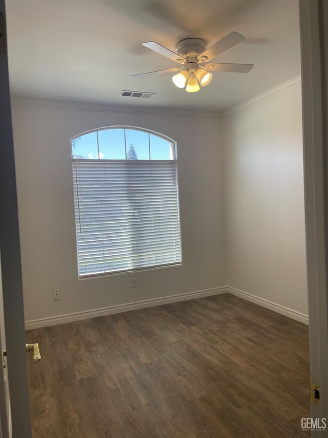 10931 Vista Del Valle Dr, Bakersfield, CA 93311 - empty room with crown molding, a ceiling fan, and dark wood-style flooring
