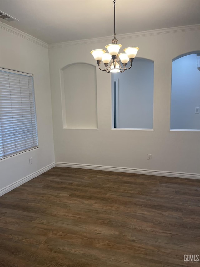 10931 Vista Del Valle Dr, Bakersfield, CA 93311 - unfurnished room with a chandelier, crown molding, dark wood-type flooring, and arched walkways
