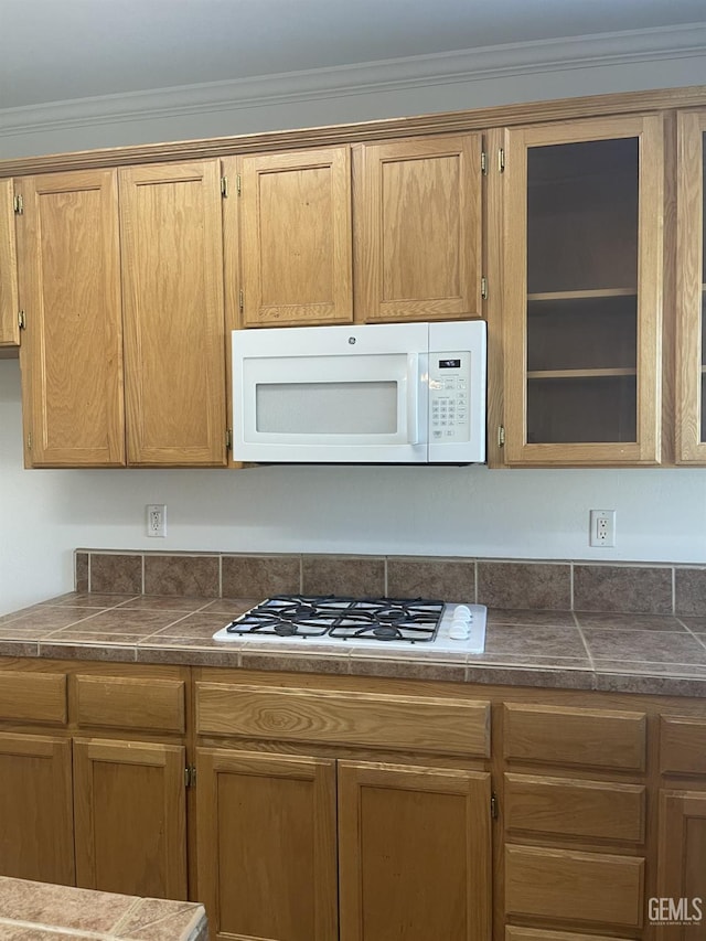10931 Vista Del Valle Dr, Bakersfield, CA 93311 - kitchen featuring white appliances, dark countertops, and ornamental molding