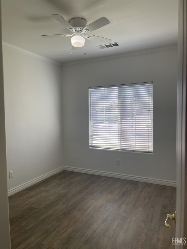 10931 Vista Del Valle Dr, Bakersfield, CA 93311 - spare room with plenty of natural light, dark wood-style floors, ornamental molding, and ceiling fan