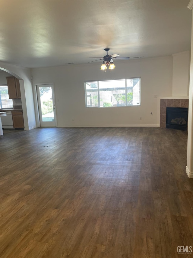 10931 Vista Del Valle Dr, Bakersfield, CA 93311 - unfurnished living room featuring ceiling fan, dark wood-type flooring, and healthy amount of natural light