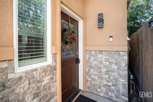 entrance foyer with a barn door and a wall mounted AC