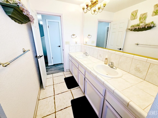 bathroom featuring vanity, tasteful backsplash, and tile patterned floors