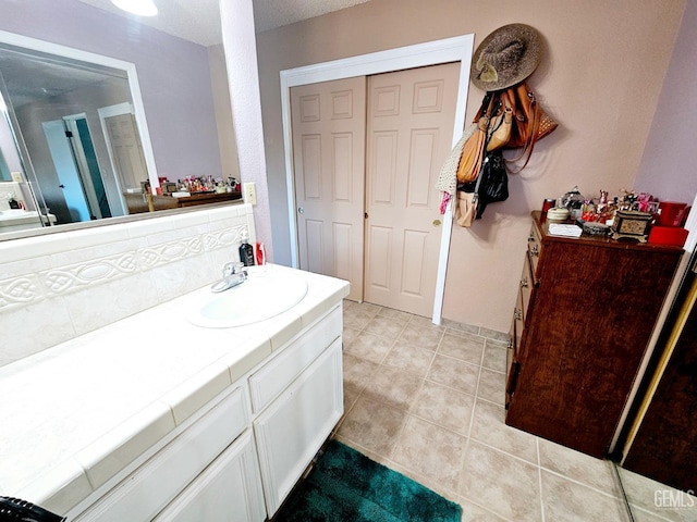 bathroom with vanity and tile patterned flooring