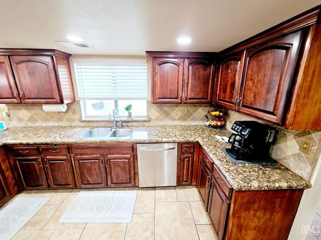 kitchen featuring sink, dishwasher, backsplash, light stone countertops, and light tile patterned flooring