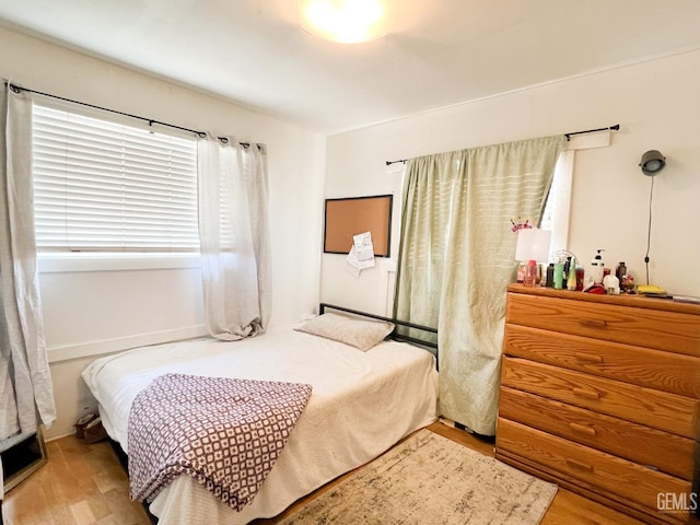 bedroom featuring wood finished floors