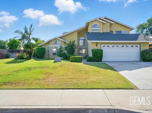 3717 Alcott Dr, Bakersfield, CA 93311 - view of front facade with driveway and an attached garage