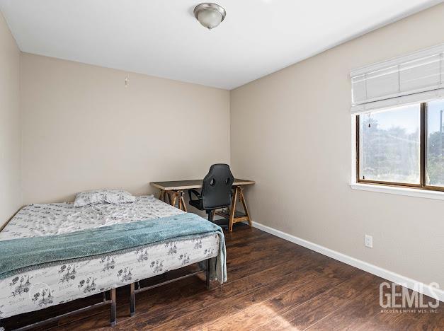 3717 Alcott Dr, Bakersfield, CA 93311 - bedroom featuring baseboards and wood finished floors