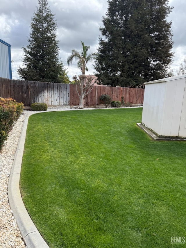 view of yard with a fenced backyard