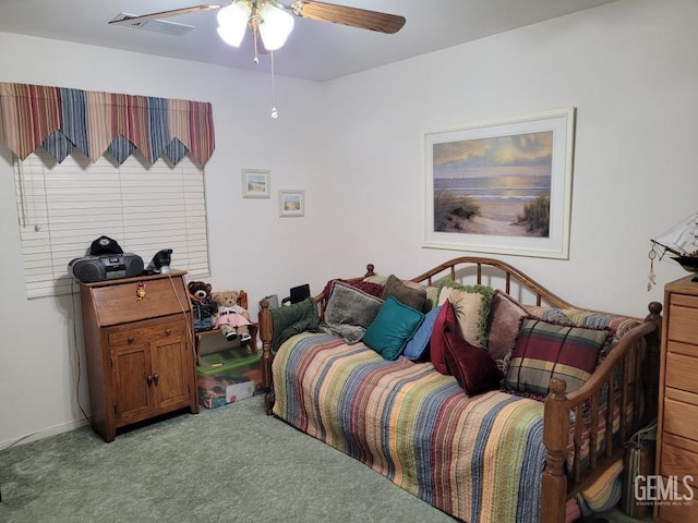 bedroom with a ceiling fan, visible vents, and carpet floors