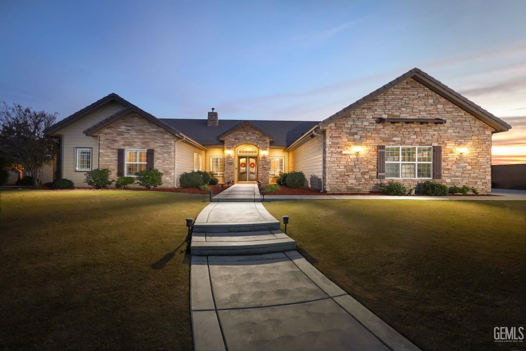 view of front of house with a yard