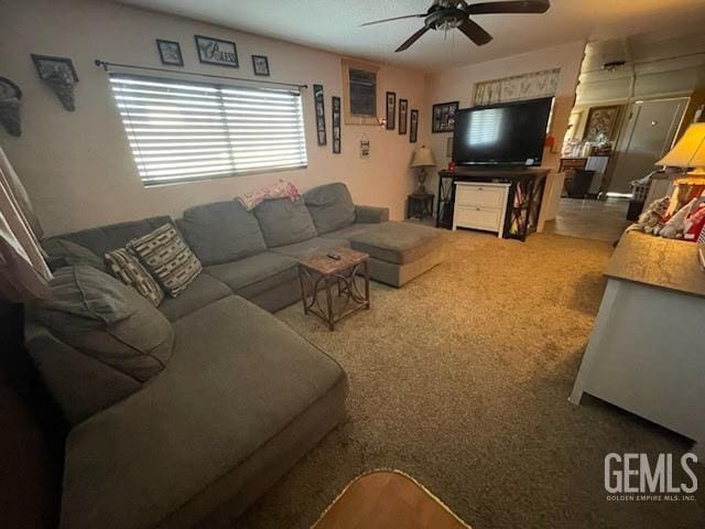 living room featuring carpet floors and ceiling fan