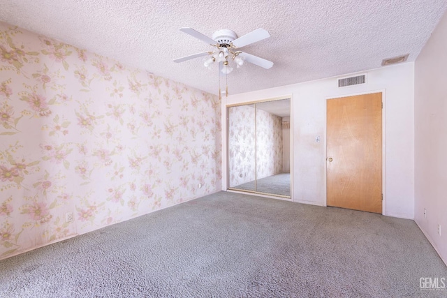 1830 Chevy Chase Way, Bakersfield, CA 93306 - unfurnished bedroom featuring carpet floors, wallpapered walls, a closet, ceiling fan, and a textured ceiling