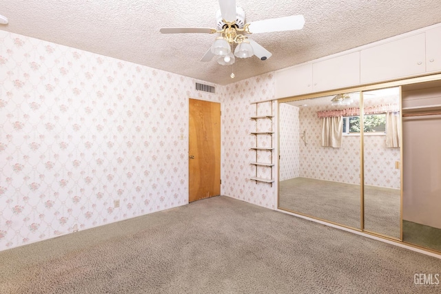 1830 Chevy Chase Way, Bakersfield, CA 93306 - unfurnished bedroom featuring carpet floors, wallpapered walls, a textured ceiling, a closet, and ceiling fan