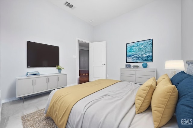 bedroom featuring baseboards and visible vents