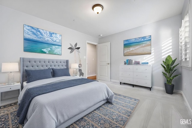 bedroom featuring carpet floors and baseboards