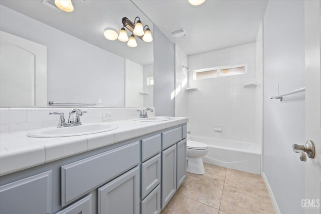 bathroom with tile patterned flooring, visible vents, a sink, and double vanity