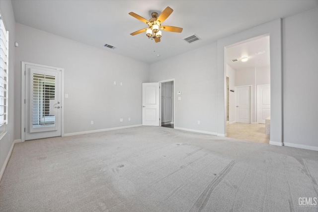 unfurnished bedroom with light carpet, access to outside, visible vents, and baseboards