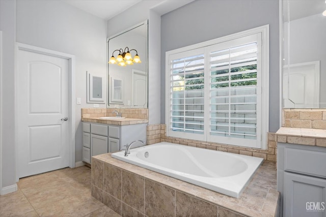 full bath featuring tile patterned flooring, a garden tub, and vanity