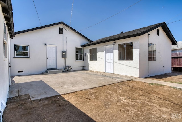 702 Wilson Ave, Bakersfield, CA 93308 - rear view of property with stucco siding, a patio, and crawl space