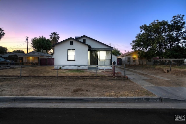 702 Wilson Ave, Bakersfield, CA 93308 - bungalow featuring a fenced front yard, crawl space, and stucco siding