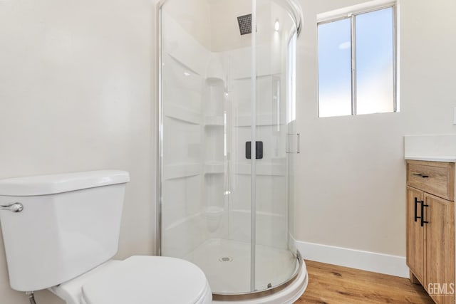 702 Wilson Ave, Bakersfield, CA 93308 - bathroom with a shower stall, wood finished floors, and vanity