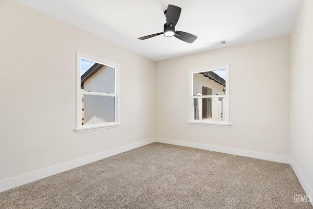 702 Wilson Ave, Bakersfield, CA 93308 - carpeted empty room with baseboards and a ceiling fan