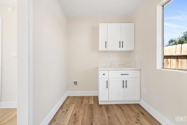 702 Wilson Ave, Bakersfield, CA 93308 - indoor dry bar featuring healthy amount of natural light and light wood-style floors