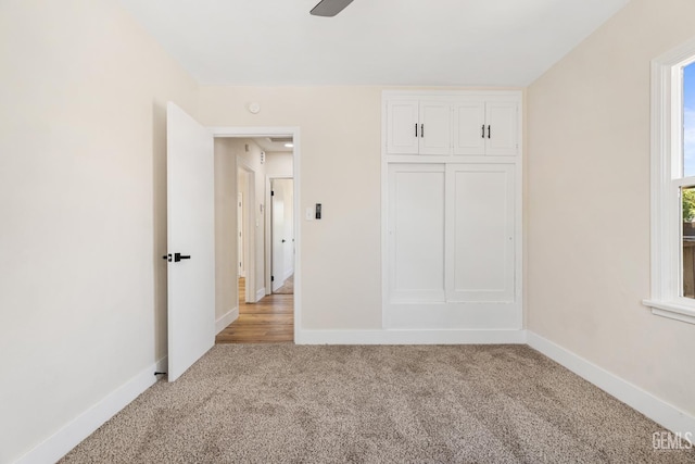 702 Wilson Ave, Bakersfield, CA 93308 - unfurnished bedroom with light carpet, a closet, and ceiling fan