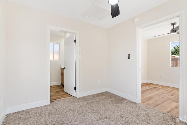 702 Wilson Ave, Bakersfield, CA 93308 - spare room featuring carpet floors, a ceiling fan, and attic access