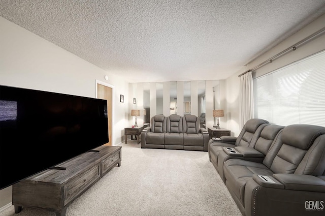 carpeted living room featuring a textured ceiling