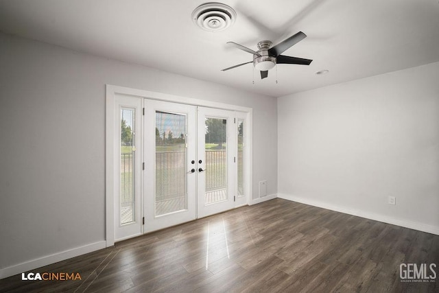 spare room featuring ceiling fan, dark hardwood / wood-style floors, and french doors